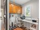 Bright craft room features natural light, wood cabinets, and a large workstation at 1285 S 1100 E, Zionsville, IN 46077