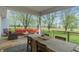 Spacious covered deck featuring an outdoor seating area and dining space with views of the backyard at 1285 S 1100 E, Zionsville, IN 46077