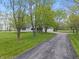 Beautiful home with a long driveway lined with trees, offering a serene and private setting at 1285 S 1100 E, Zionsville, IN 46077