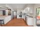Well-equipped kitchen with stainless steel appliances, an island with bar seating, and a view to the deck at 1285 S 1100 E, Zionsville, IN 46077