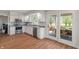 Bright kitchen with modern appliances, white cabinets, and a seamless transition to the outdoor deck at 1285 S 1100 E, Zionsville, IN 46077