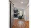 Open concept living room with a cozy fireplace, modern sliding barn door, and plush seating at 1285 S 1100 E, Zionsville, IN 46077