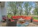 Inviting outdoor seating area with wicker furniture, vibrant cushions, and a charming wooden deck at 1285 S 1100 E, Zionsville, IN 46077