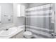 Well-maintained bathroom featuring a shower/tub combo, modern vanity, and neutral color scheme at 13451 All American Rd, Fishers, IN 46037