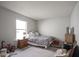 Bright bedroom with window and neutral decor at 13451 All American Rd, Fishers, IN 46037