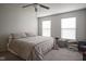 Cozy bedroom with two windows and ceiling fan at 13451 All American Rd, Fishers, IN 46037