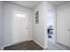 Welcoming foyer with dark wood floors that leads to a study at 13451 All American Rd, Fishers, IN 46037