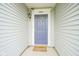Close up of blue front door, with house number, front porch, and welcome mat at 13451 All American Rd, Fishers, IN 46037