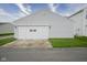 Attached two-car garage featuring a well-maintained driveway and traditional exterior lighting at 13451 All American Rd, Fishers, IN 46037