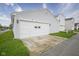 Attached two-car garage featuring a well-maintained driveway and traditional exterior lighting at 13451 All American Rd, Fishers, IN 46037