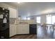 The kitchen sink and appliances overlook an open-concept dining and living area, perfect for entertaining at 13451 All American Rd, Fishers, IN 46037