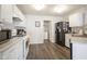 Functional kitchen equipped with white cabinetry and black appliances, offering ample counter space and modern convenience at 13451 All American Rd, Fishers, IN 46037