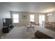 Spacious open-plan living and dining area with plush gray carpet and neutral tones at 13451 All American Rd, Fishers, IN 46037
