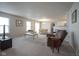 Spacious open-plan living and dining area with plush gray carpet and neutral tones at 13451 All American Rd, Fishers, IN 46037