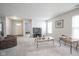 Bright, open-plan living space with gray carpet and access to other rooms at 13451 All American Rd, Fishers, IN 46037