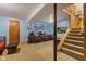 Basement with comfortable seating, television, and staircase access to another level at 150 Church St, Mooresville, IN 46158