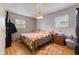 Bright bedroom with wood floors, and a quaint area rug and window at 150 Church St, Mooresville, IN 46158