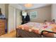 Cozy bedroom with hardwood floors, closet, and a TV for ultimate relaxation at 150 Church St, Mooresville, IN 46158