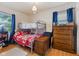 Bedroom featuring a bunk bed with a red and white quilt, chest, and bureau at 150 Church St, Mooresville, IN 46158