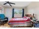 Bedroom featuring a classic wood-framed bed and a window with natural light at 150 Church St, Mooresville, IN 46158