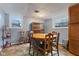 Cozy dining area featuring a round wooden table and chairs near bright windows at 150 Church St, Mooresville, IN 46158