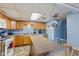 Functional kitchen with wooden cabinets, laminate countertops, and island seating at 150 Church St, Mooresville, IN 46158