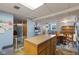 Kitchen features a center island, blue walls, and an adjacent dining area at 150 Church St, Mooresville, IN 46158