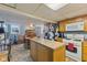 Kitchen with center island, adjacent dining area featuring a wooden table and chairs at 150 Church St, Mooresville, IN 46158