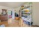 Well-lit living room with hardwood floors and view into adjacent bedroom at 150 Church St, Mooresville, IN 46158