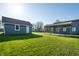 A spacious backyard showcases a detached garage and a covered patio area at 1509 S Spencer Ave, Indianapolis, IN 46203