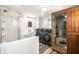 Modern bathroom with a glass shower, updated sink, washer, dryer, and a sauna at 1509 S Spencer Ave, Indianapolis, IN 46203