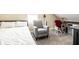 Inviting bedroom area featuring a chair, desk, and comfortable sleeping space at 1509 S Spencer Ave, Indianapolis, IN 46203