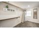 Walk-in closet with built-in storage shelves and rod for hanging clothes at 1509 S Spencer Ave, Indianapolis, IN 46203