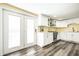 Spacious kitchen with white cabinets, stainless steel appliances, and an access door at 1509 S Spencer Ave, Indianapolis, IN 46203