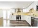 Modern kitchen with stainless steel appliances, white cabinets and ample counter space at 1509 S Spencer Ave, Indianapolis, IN 46203