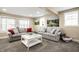 Spacious living room with stylish sofas, a modern coffee table and bright windows at 1509 S Spencer Ave, Indianapolis, IN 46203