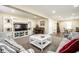 Inviting living area featuring a built-in entertainment center and an upright piano at 1509 S Spencer Ave, Indianapolis, IN 46203