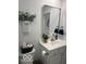 Bathroom featuring a modern sink, toilet, and decorative elements at 1511 Coen Ct, Columbus, IN 47201