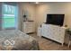 Cozy bedroom featuring a comfortable bed, neutral color palette, and ample natural light at 1511 Coen Ct, Columbus, IN 47201