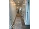 Bright hallway with wood-look floors and a decorative runner at 1511 Coen Ct, Columbus, IN 47201