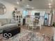 Open-concept living space with a modern kitchen, a cozy living room, and ample lighting at 1511 Coen Ct, Columbus, IN 47201