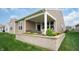 Beautiful backyard features a cozy covered patio with landscaping and an attractive retaining wall at 16201 Haywood St, Fishers, IN 46037