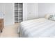Cozy bedroom with double door closet, built-in shelving and a full bed with striped comforter and pillows at 16201 Haywood St, Fishers, IN 46037