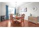 Charming dining room with a chandelier, hardwood floors, and ample natural light at 16201 Haywood St, Fishers, IN 46037