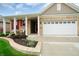 Attractive home exterior with lush landscaping, and an attached two-car garage at 16201 Haywood St, Fishers, IN 46037