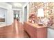 Inviting foyer with hardwood floors, decorative table, and colorful wall art at 16201 Haywood St, Fishers, IN 46037