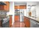 Updated kitchen showcasing stainless steel appliances, granite countertops, and ample cabinet space at 16201 Haywood St, Fishers, IN 46037