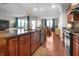 Beautiful kitchen with cherry cabinets, granite countertops, and stainless steel appliances at 16201 Haywood St, Fishers, IN 46037