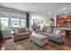 Bright living room with hardwood floors, recessed lighting, and views of the dining room and kitchen at 16201 Haywood St, Fishers, IN 46037