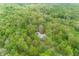 A beautiful aerial shot showcasing multiple cabins surrounded by verdant trees and parking at 1630 Hinson Rd, Martinsville, IN 46151